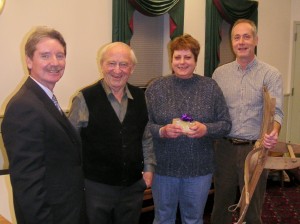 Media Council Pres. Frank Daly & Hal Taussig with Fair Trade raffle winners Kate & Gary White, who won a 2 wk. Swiss Untour